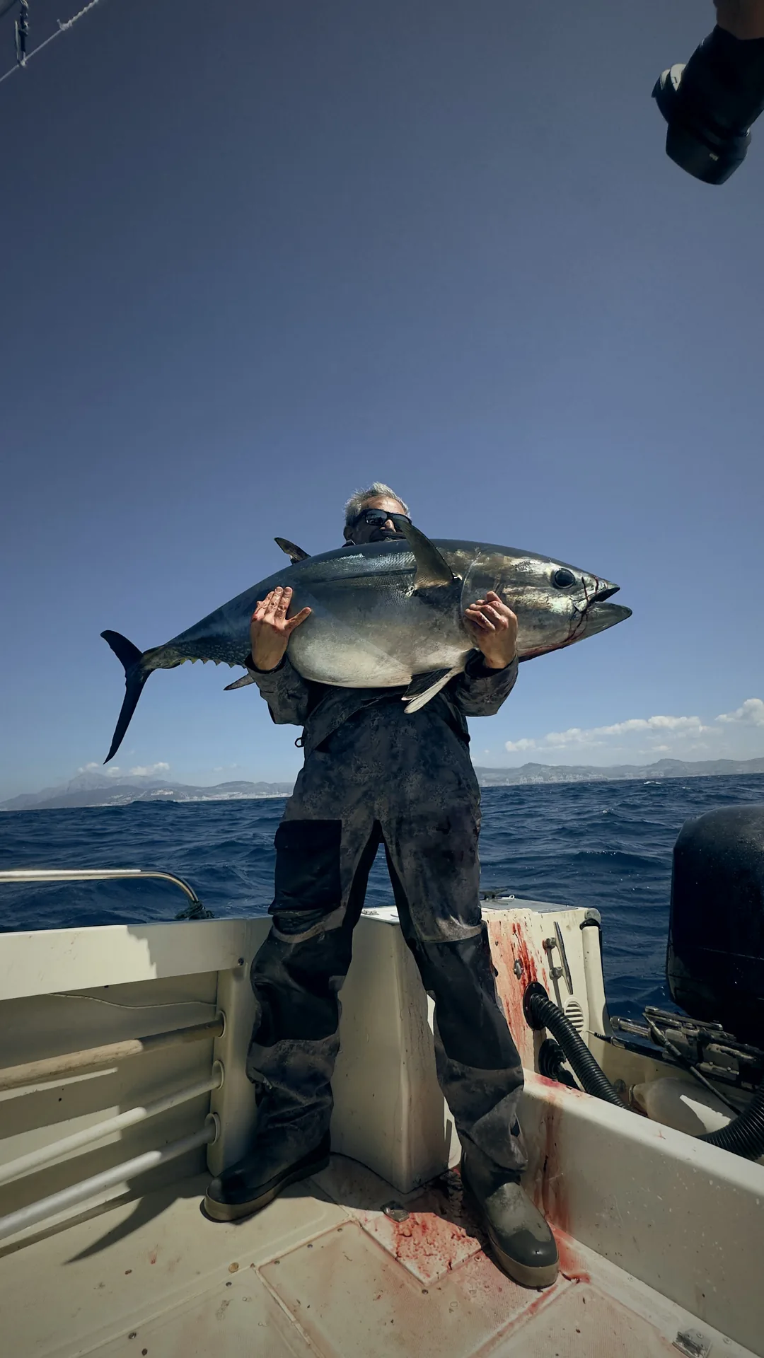Captain holding a bluefin tuna