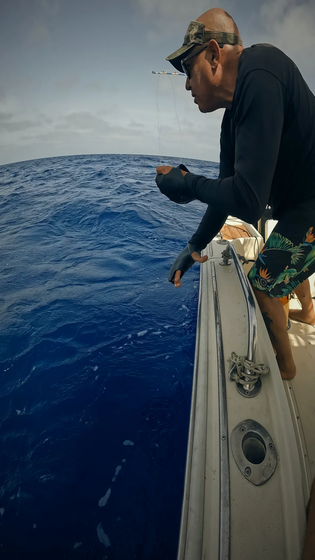 Captain Saad releasing a catch overboard